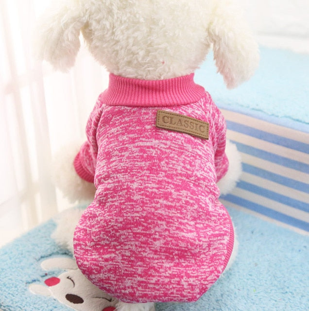 Pink winter pet sweater with ribbed collar and Classic logo patch.