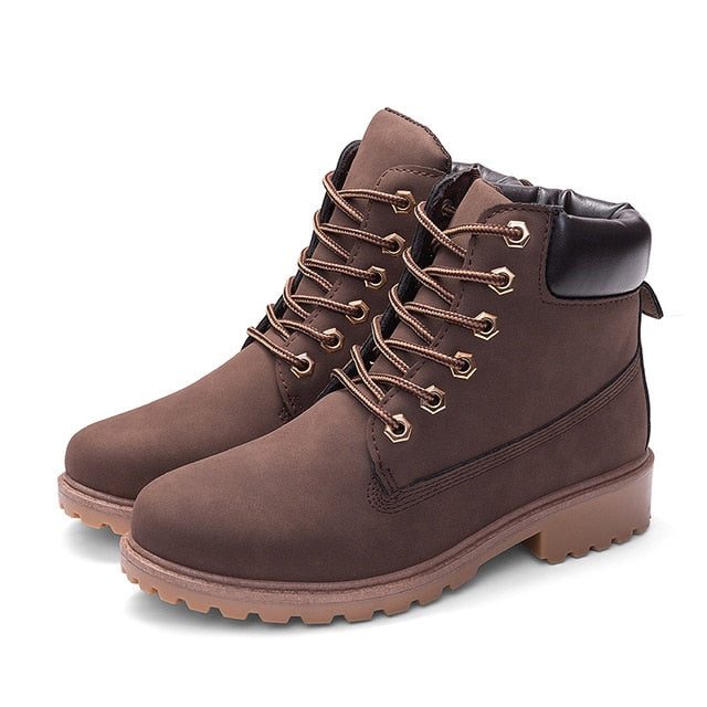 Brown women’s plush ankle boots, lace-up front with pull tab and rugged sole.