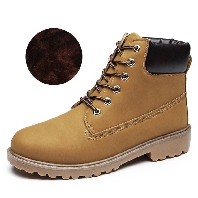 Tan women’s plush ankle boots, lace-up front with cushioned ankle collar.