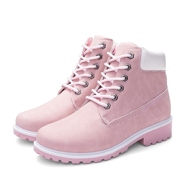 Light pink plush ankle boots with pink laces and lace-up front