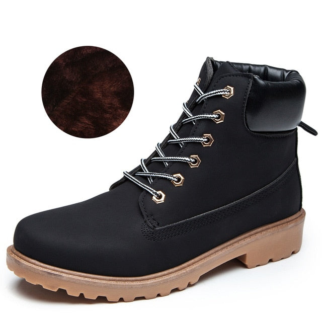Black plush ankle boots with tan sole and lace-up front