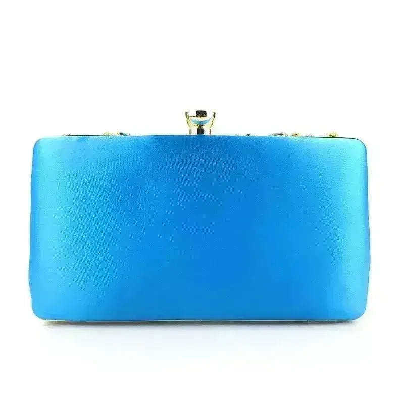 Turquoise satin clutch with gold-tone top clasp and compact rectangular shape