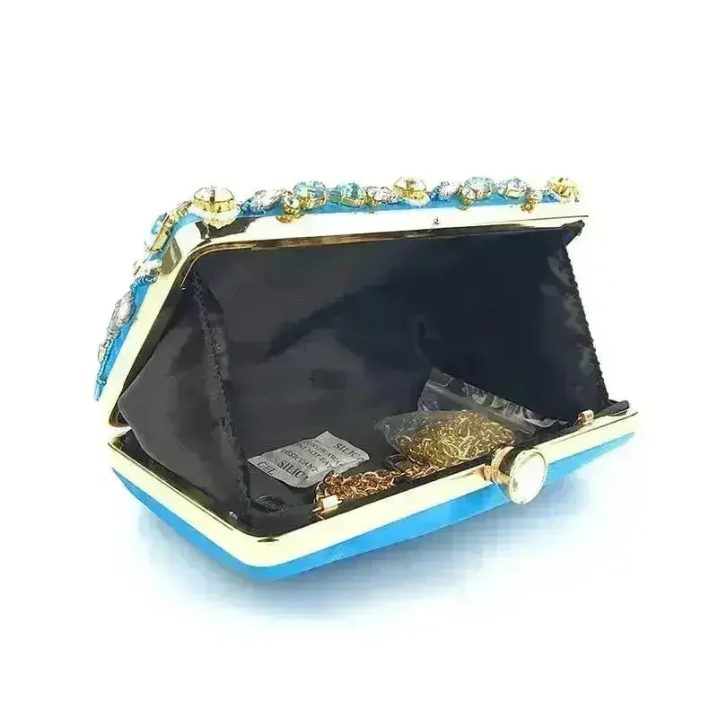 Open diamond rhinestone clutch with black lining and gold-tone clasp