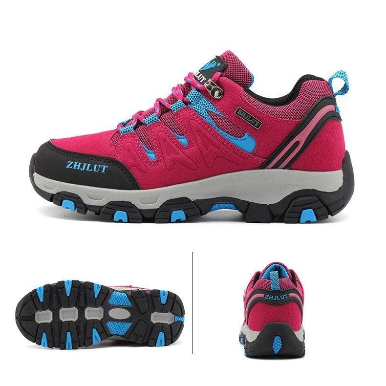 Low-top hiking shoes, magenta with teal-blue panels, black toe, and grippy sole