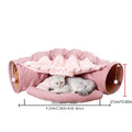 Collapsible cat tunnel tube with removable cushion, pink fabric, cat lying inside