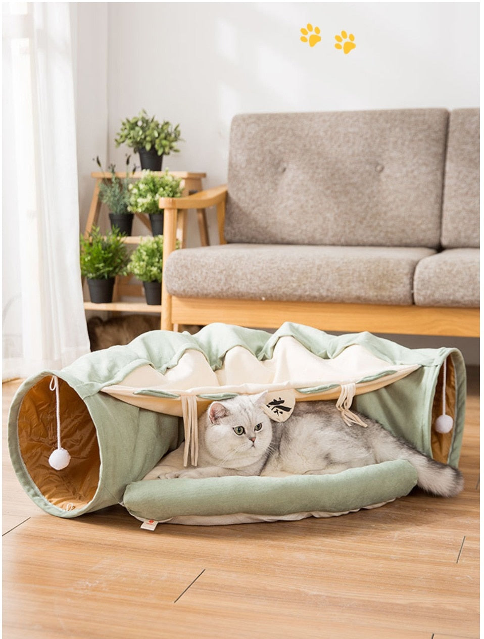Collapsible cat tunnel tube with removable cushion, mint-green fabric, cat lounging inside