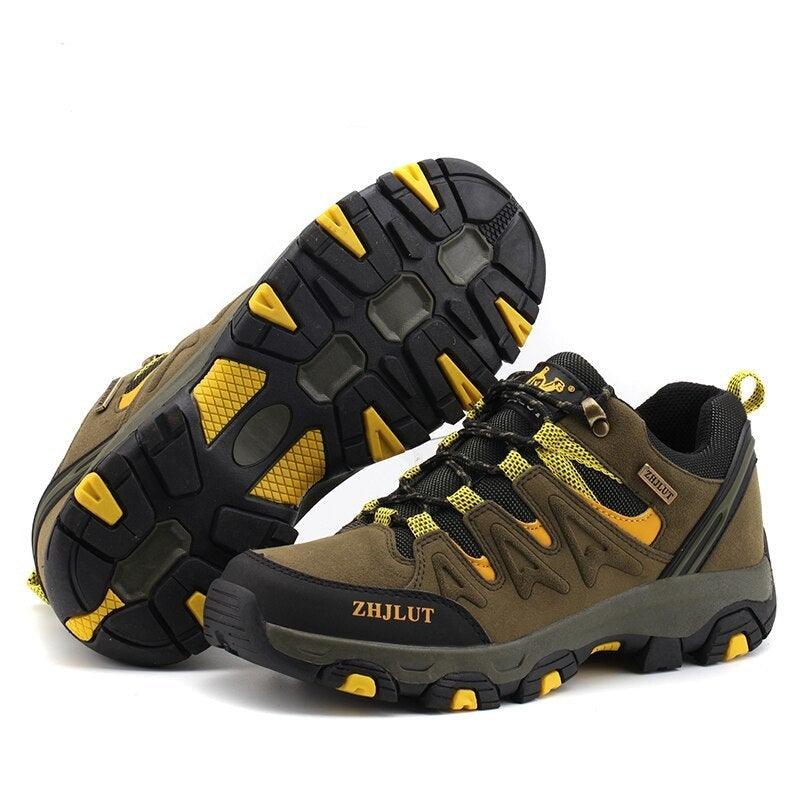 Brown hiking shoes with neon yellow details, angled view of chunky outsole tread