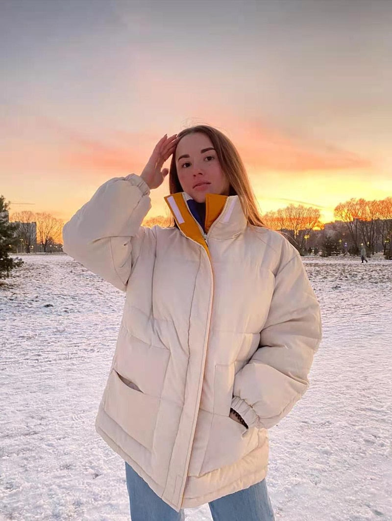 Off-white padded coat with full zipper and stand collar, winter wear