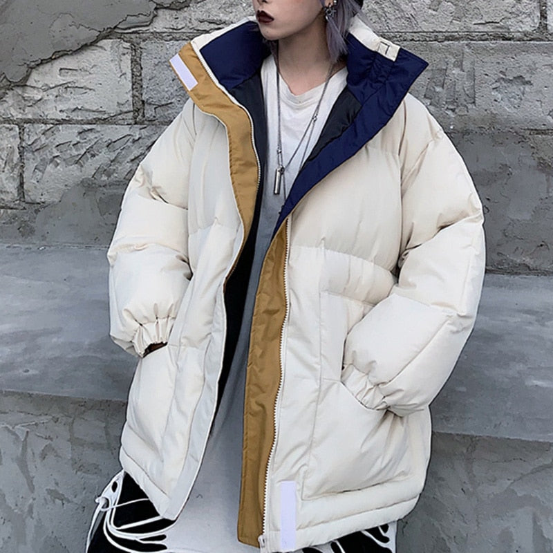 Off-white padded winter jacket with full zipper and contrasting dark blue collar