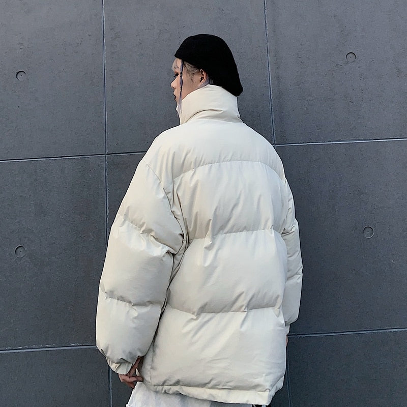 Off-white padded winter jacket from back view with full-zip and elastic cuffs