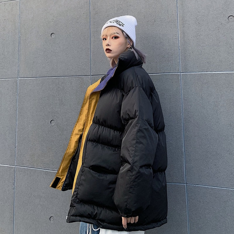 Black padded winter jacket with full zipper and stand collar, side profile