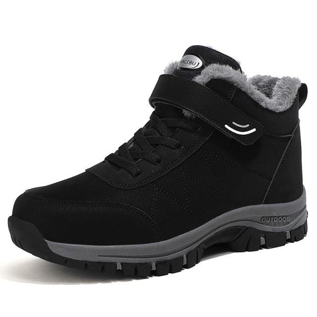 Black lace-up winter ankle boots with plush collar and rugged tread outsole.
