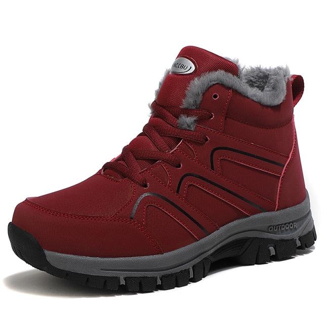 Red plush-lined lace-up winter ankle boot with padded collar and chunky grippy outsole