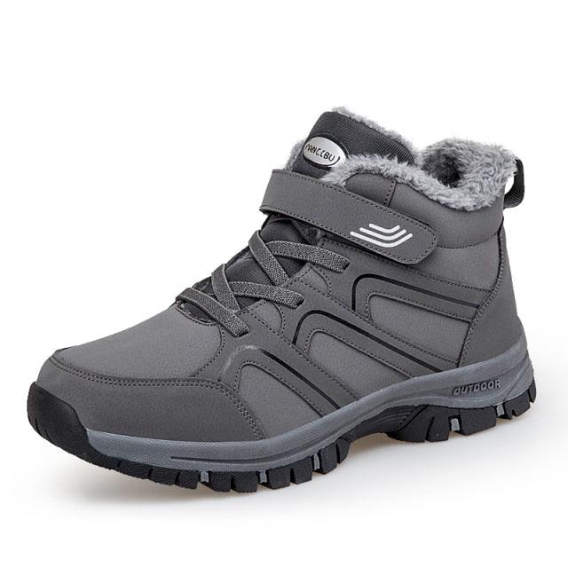 Grey plush-lined lace-up winter ankle boot with hook-and-loop strap detail and tread sole