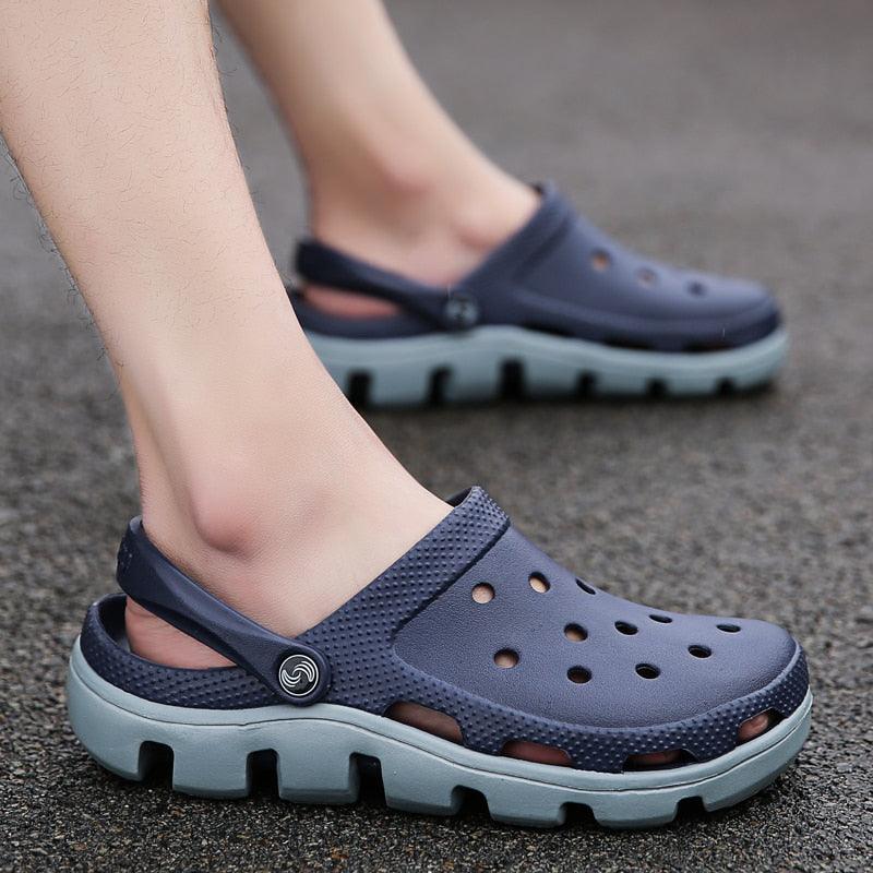 Men's blue jelly clog sandals with perforations and adjustable heel strap