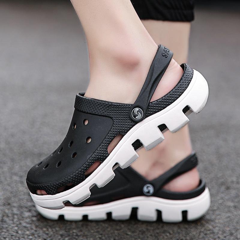 Men's black perforated jelly clogs with adjustable strap and white tread