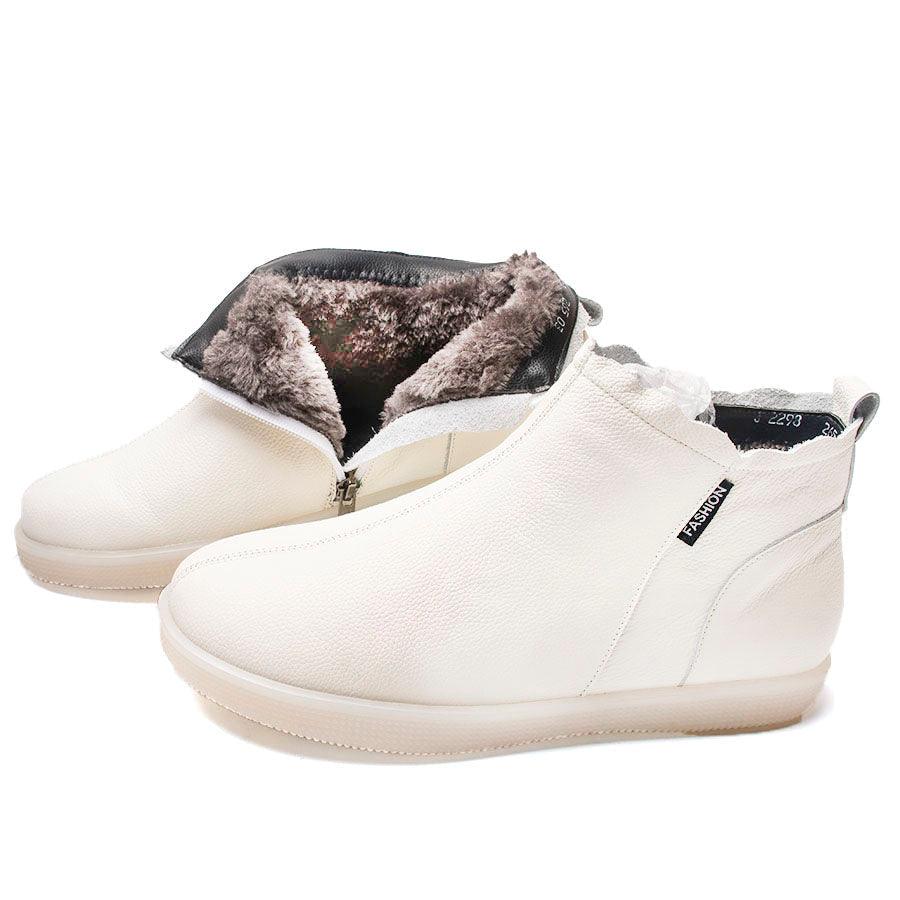 White ankle boots with side zipper and dark gray fur-lined interior