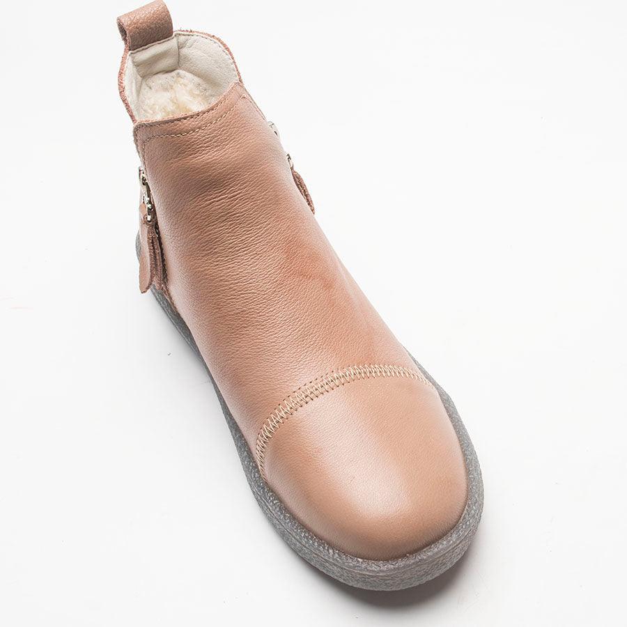 Tan leather-look ankle boot with fur lining, rounded toe, and gray sole