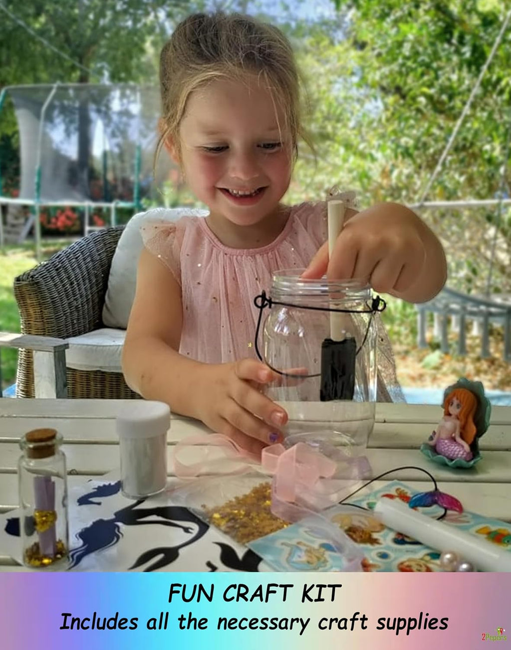 Child decorating a fairy terrarium lantern jar night light with craft pieces