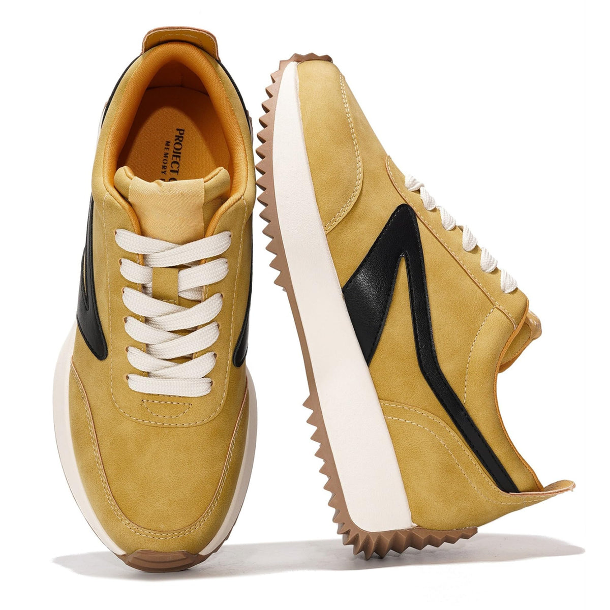 Mustard yellow lace-up sneakers with black side panels and white laces