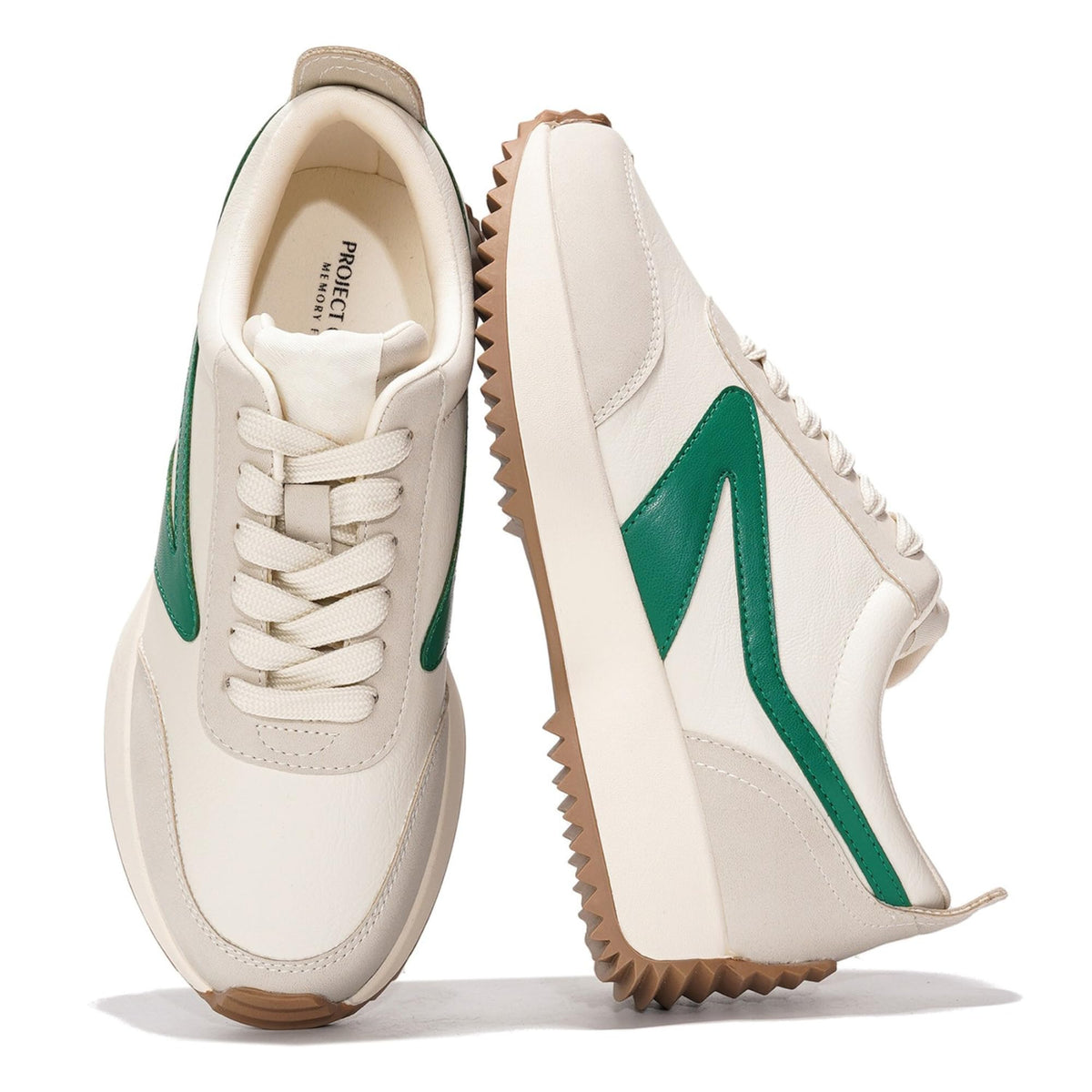 Cream womens lace-up sneakers with green side panels and chunky tread sole