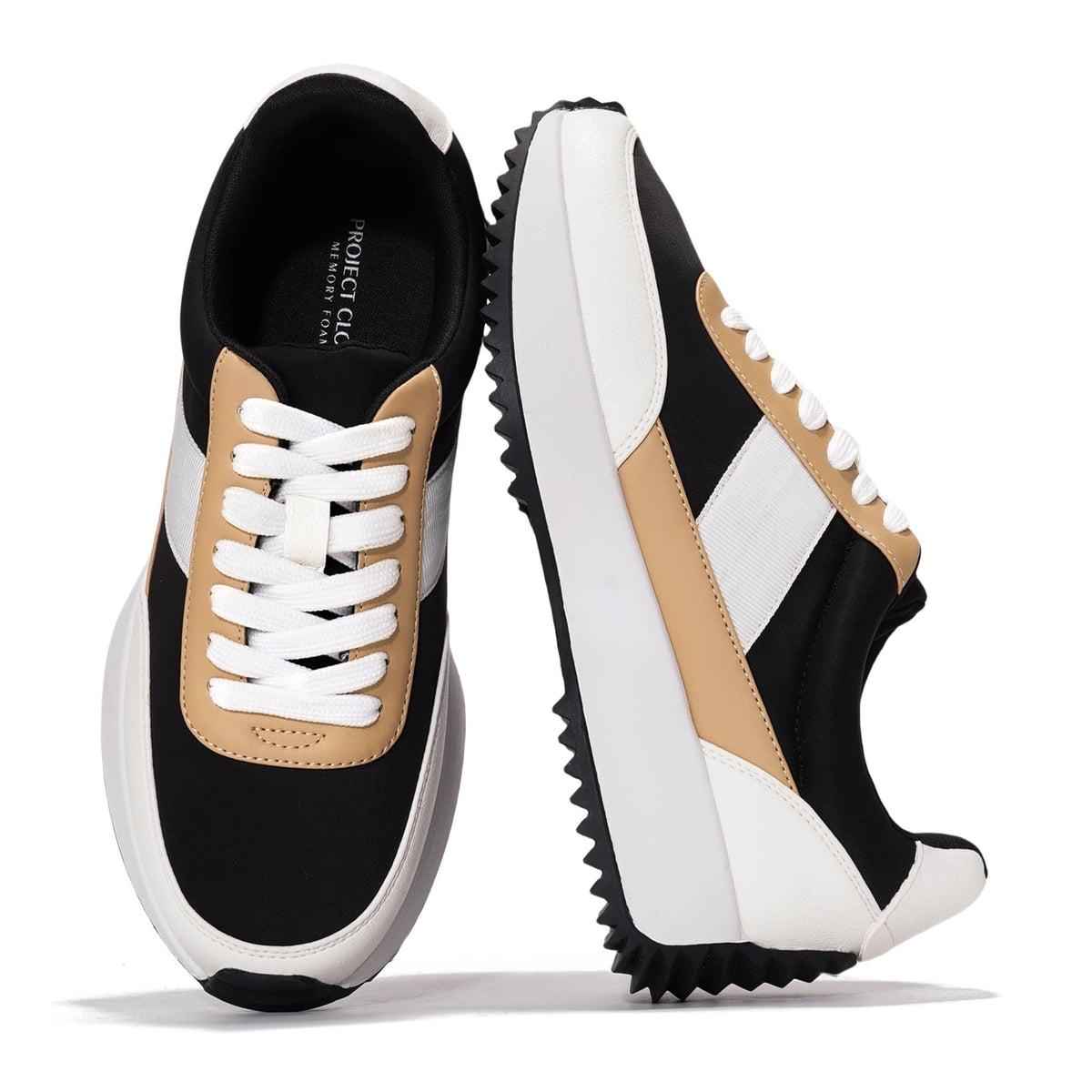 Black and white lace-up sneakers with tan leather-look panels and thick platform sole