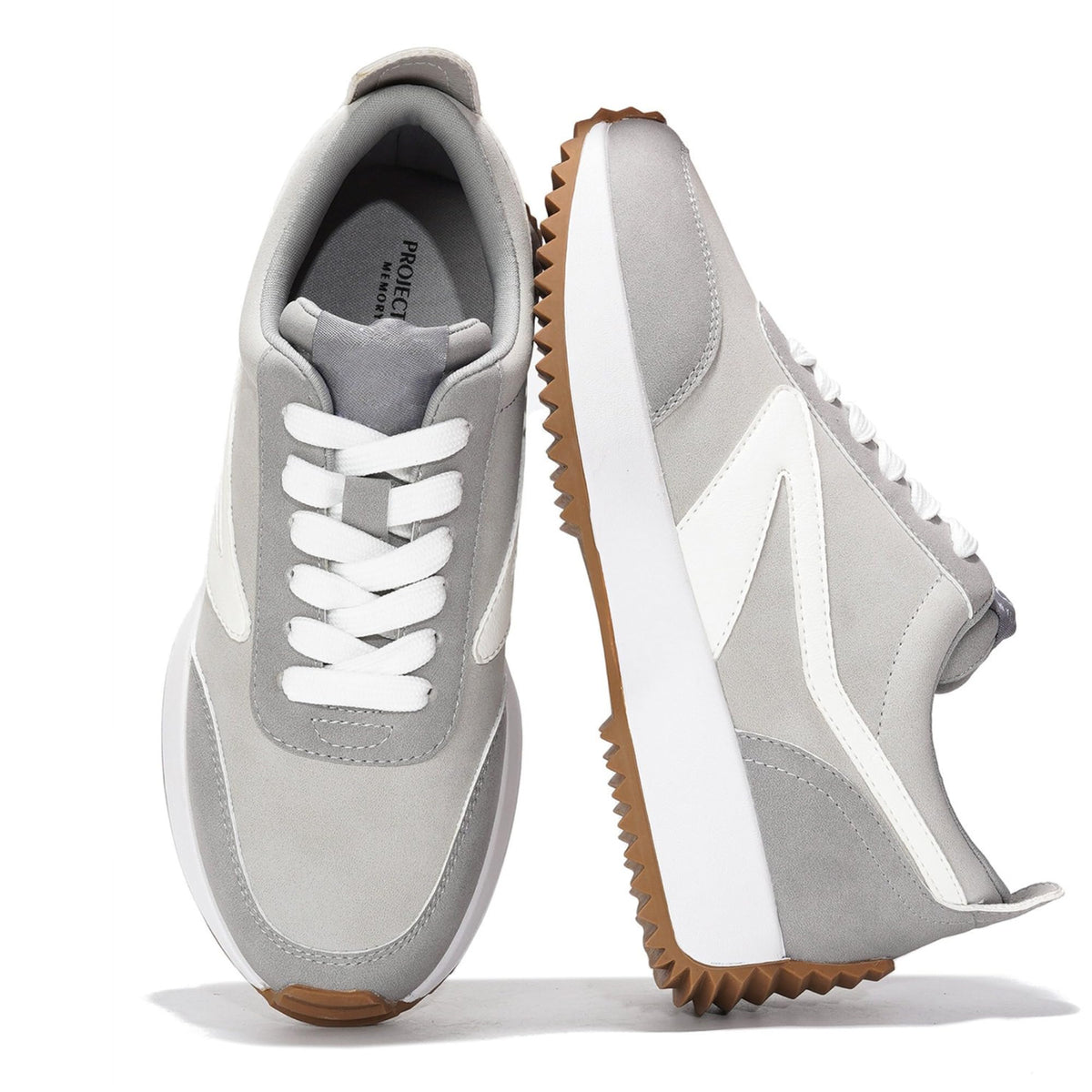 Women’s lace-up sneakers in gray with white side panels and chunky brown sole