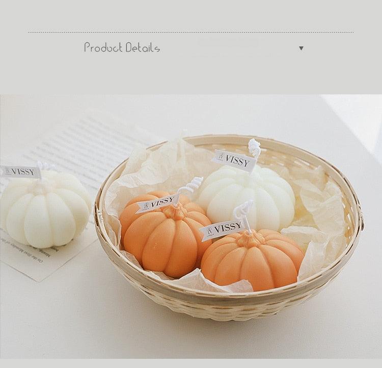 Basket of pumpkin-shaped candles in orange and white with VISSY tags