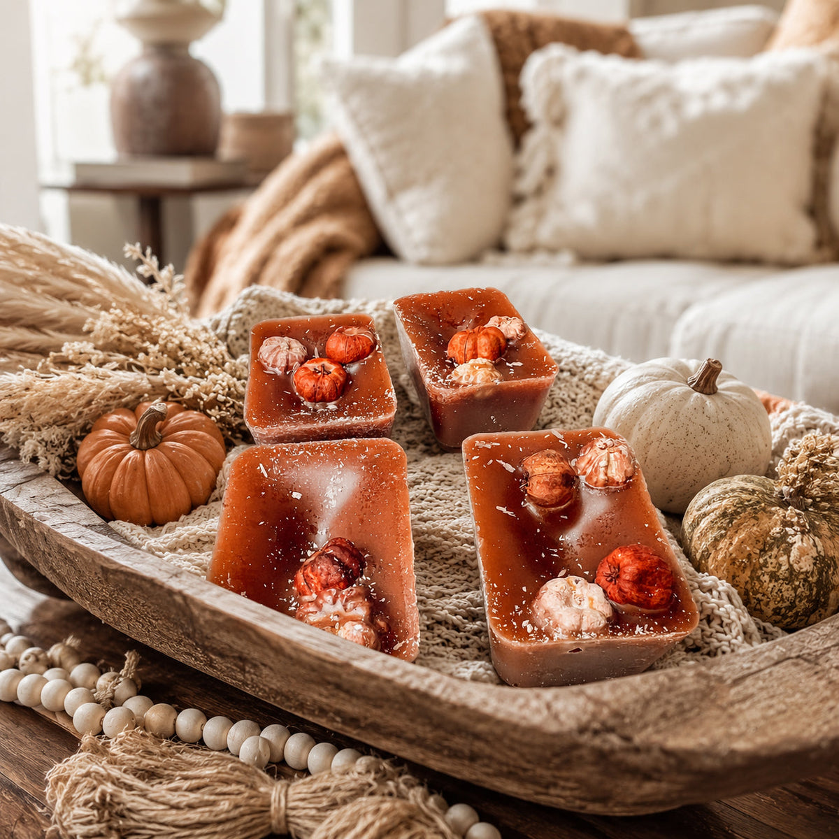 XL pumpkin pecan wax melt squares arranged in a tray, dark amber with nut bits.