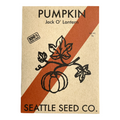 Pumpkin seed packet with Jack O' Lantern label and Seattle Seed Co. branding