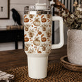 40 oz insulated tumbler with clear lid, straw, and white handle; pumpkin floral pattern