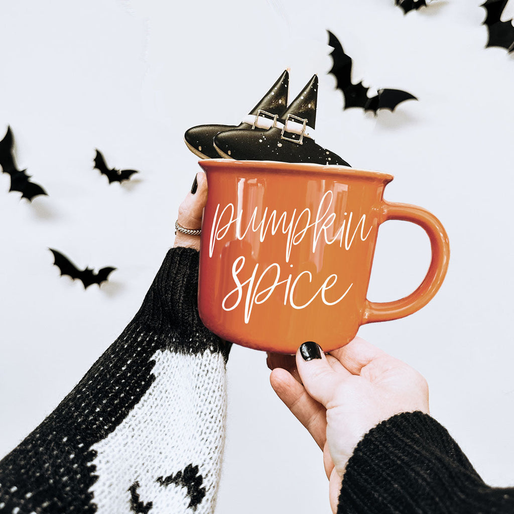 Orange ceramic mug with 'Pumpkin Spice' print and black witch hat topper