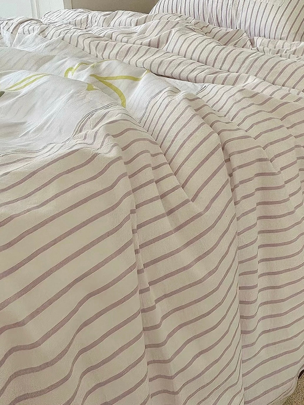 Striped duvet cover set with layered bedding and colorful animal appliques