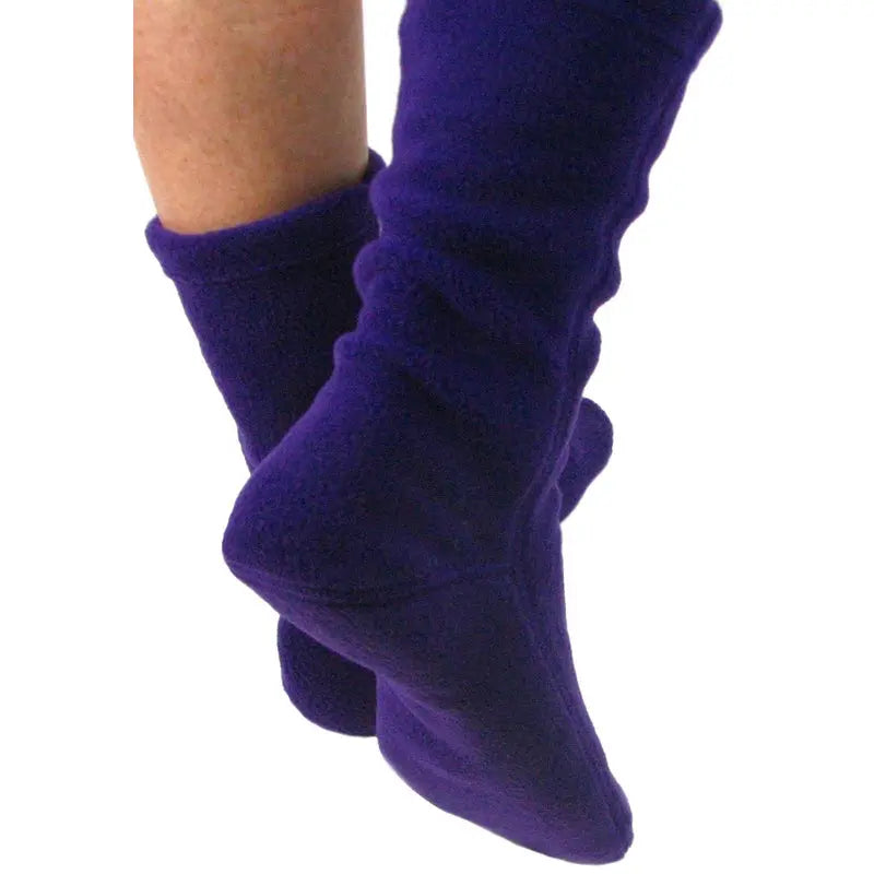 Purple fleece crew socks on ankles, stretchy ribbed cuffs