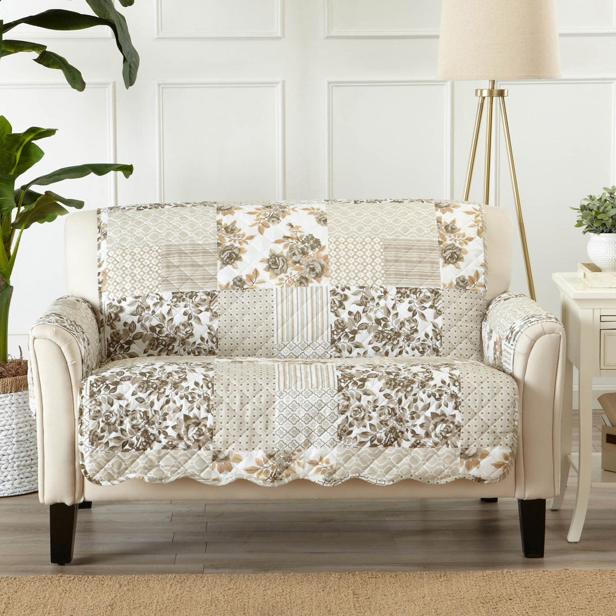 Reversible loveseat protector on beige loveseat, patchwork taupe floral and stripe panels