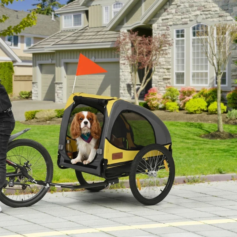 Yellow dog bike trailer pet stroller with front mesh door and orange safety flag
