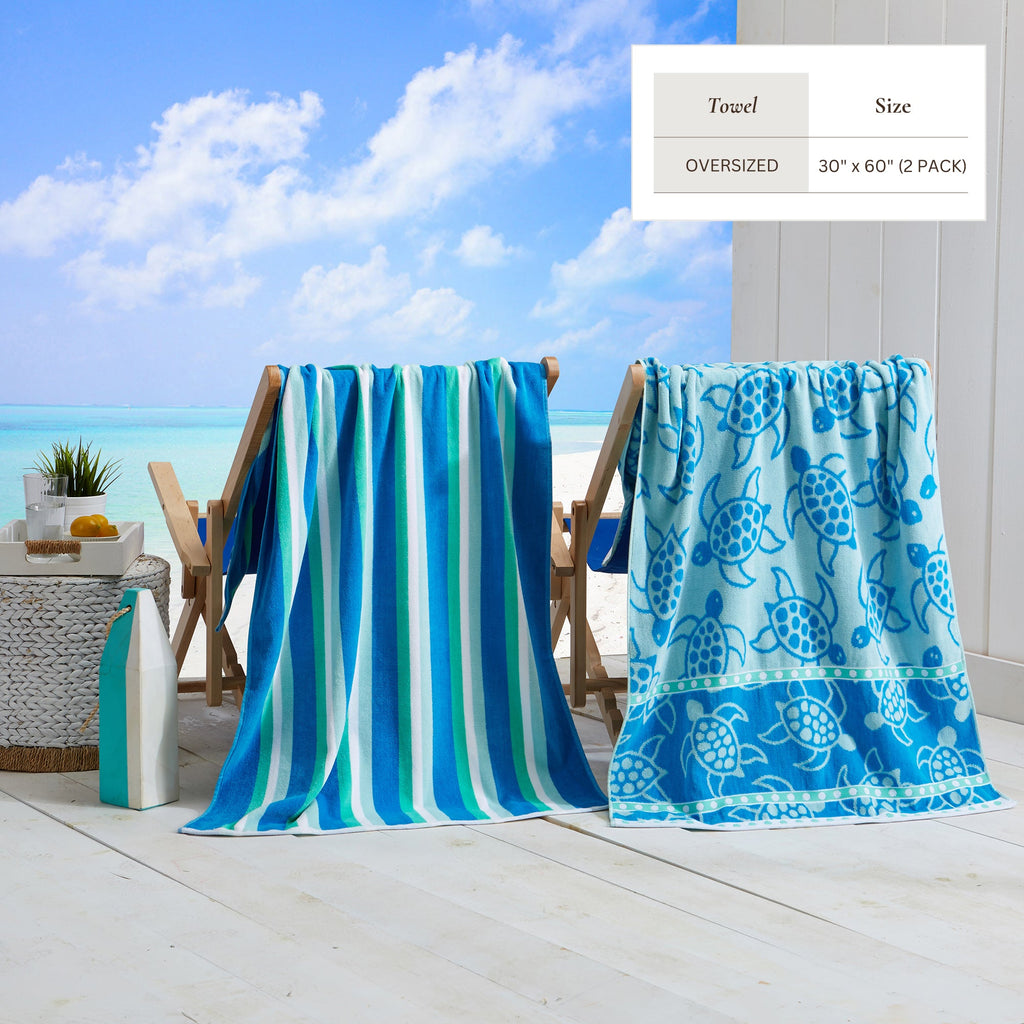 Blue cotton velour towels on chairs, one striped and one with shell motif