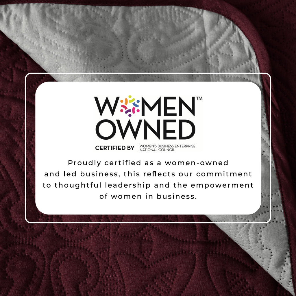 Recliner protector fabric with certification label panel near quilted burgundy stitching
