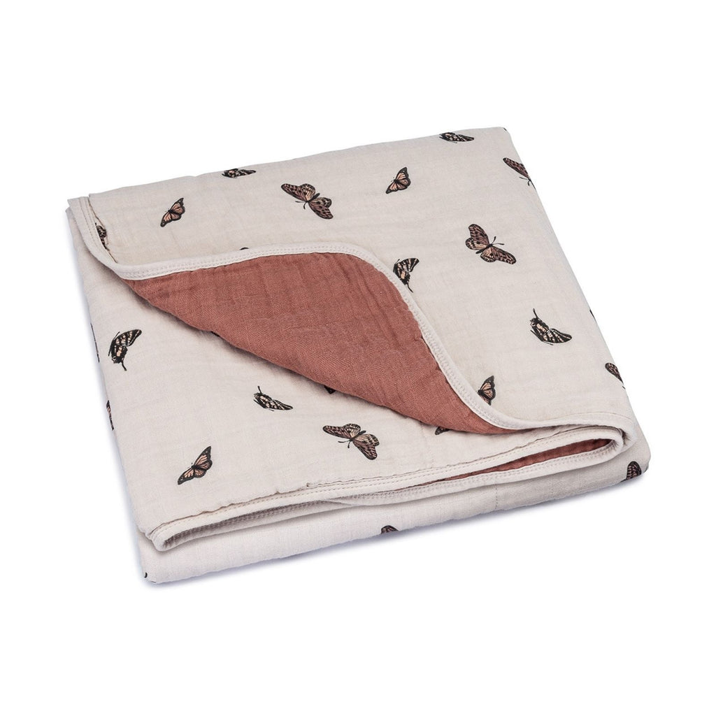 Butterfly quilt, beige muslin with dark butterfly print and terracotta backing