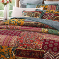 Bohemian floral cotton patchwork bedspread with red, green, and yellow paisley stripes