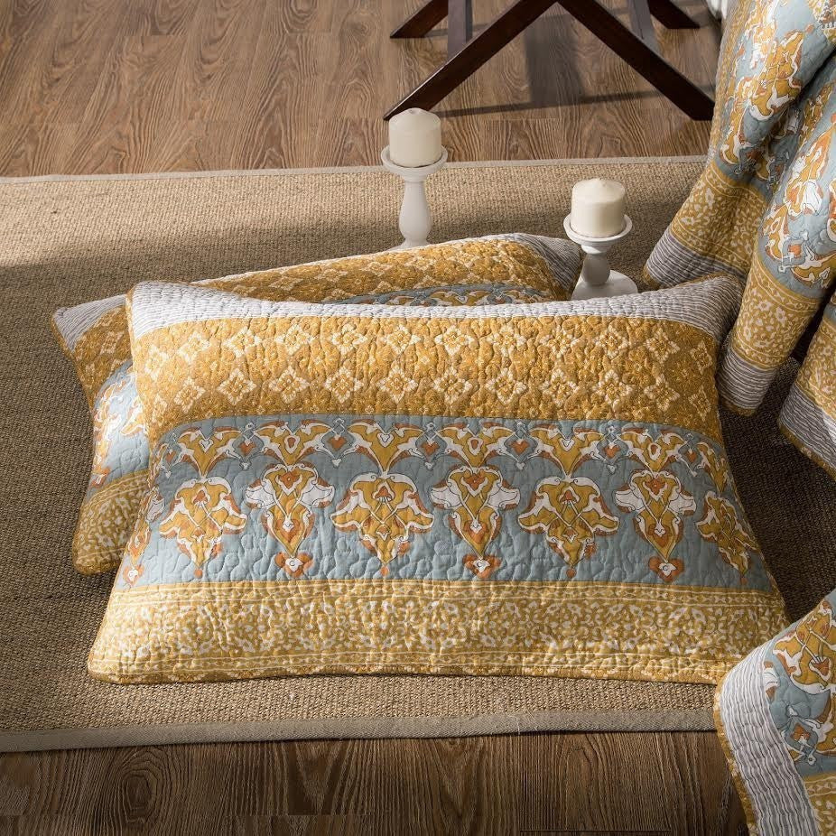 Cotton quilt bedspread set with blue-and-gold medallion pattern and striped border detail