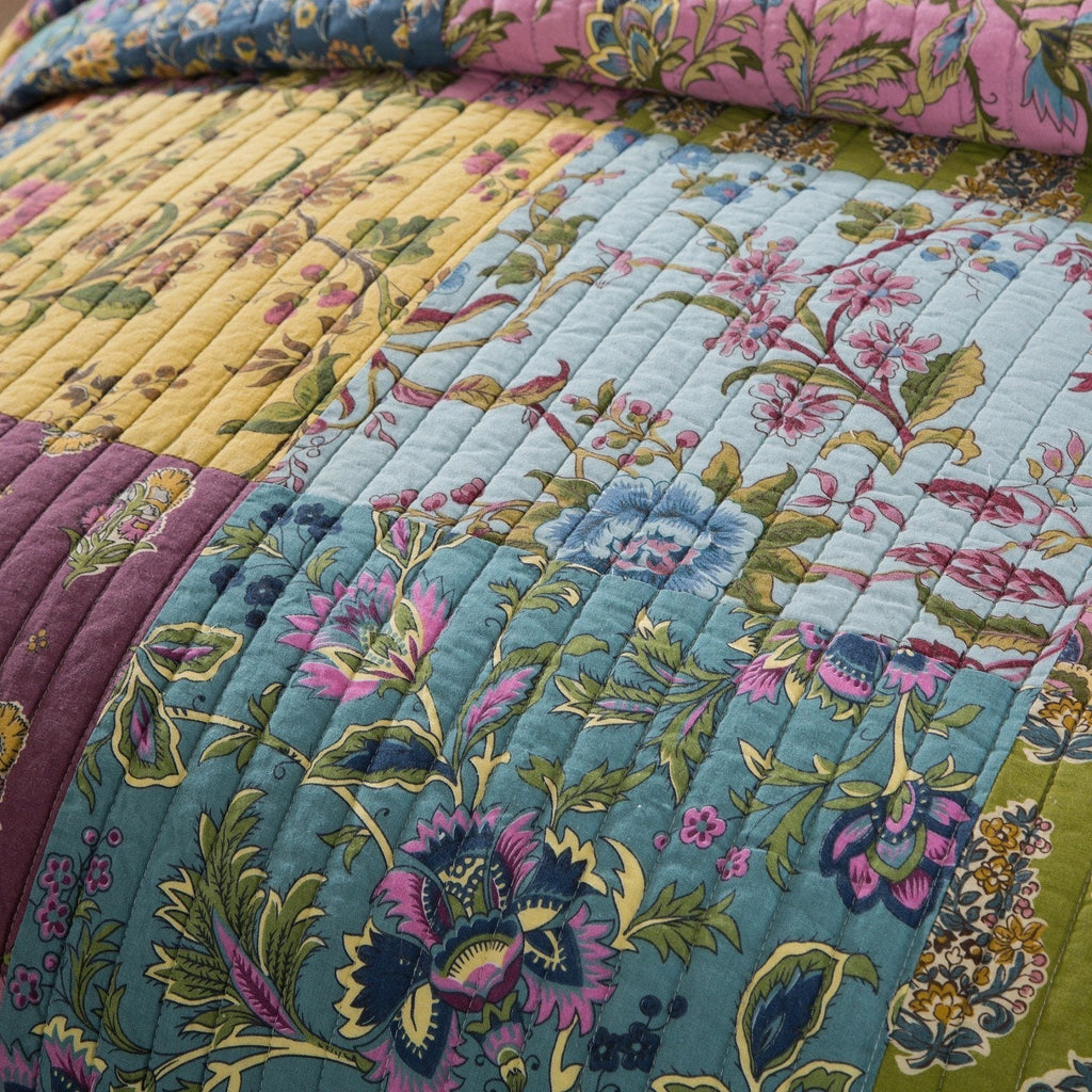 Colorful floral quilt top patchwork with stitched pattern and multicolor blocks