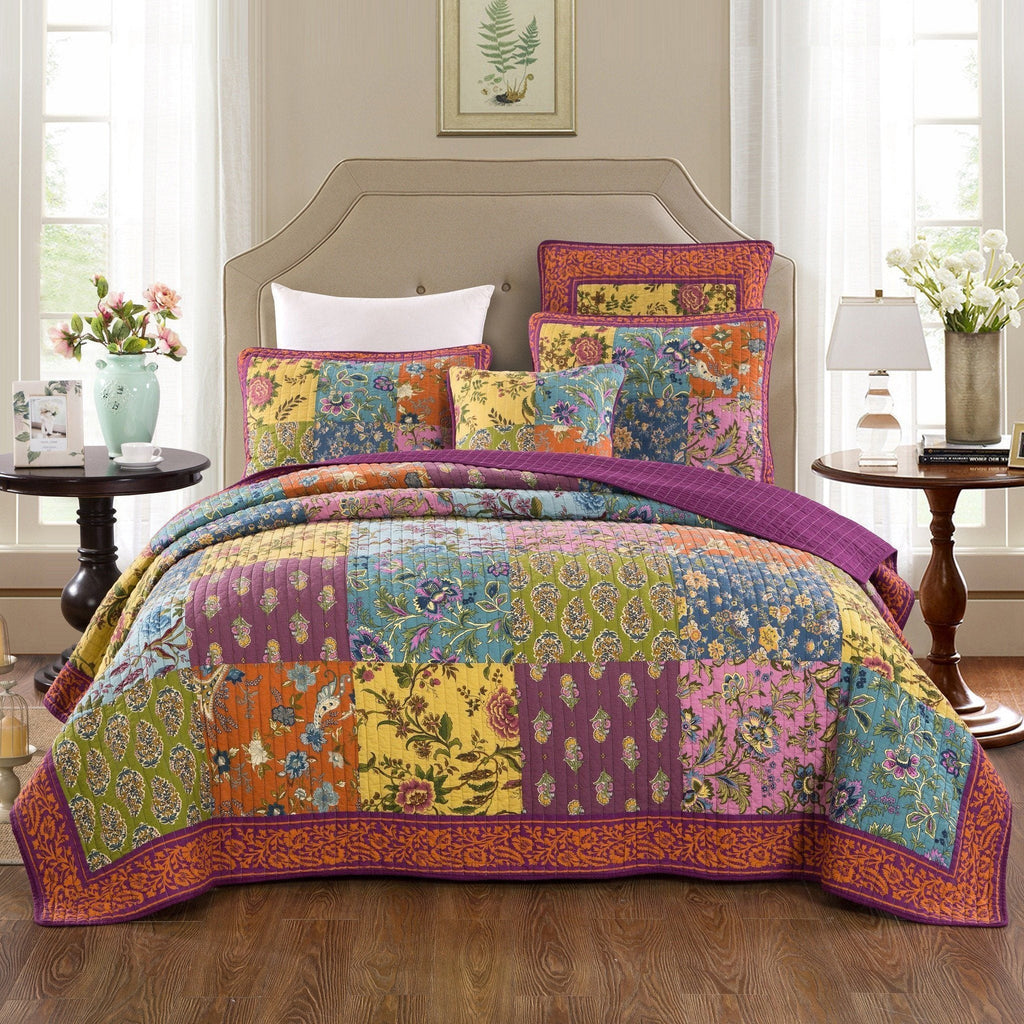 Quilted bedspread set with bright floral patchwork top and coordinating pillow shams