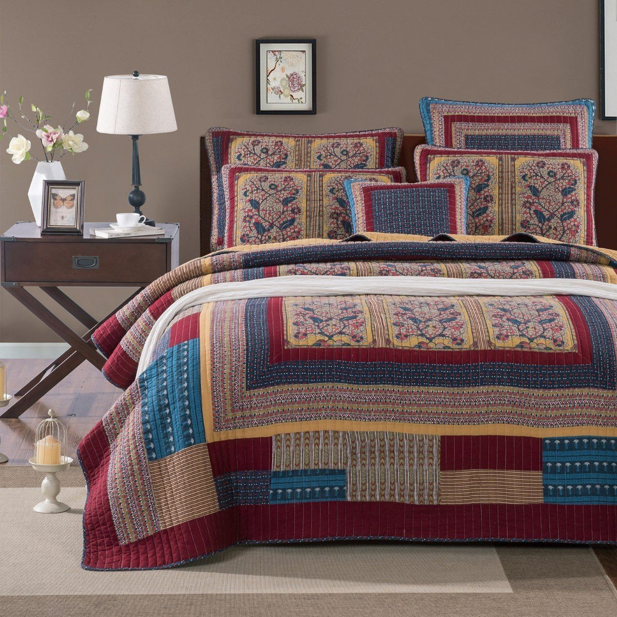 Patchwork quilt bedspread set with multicolor blocks and framed floral designs in blue and red