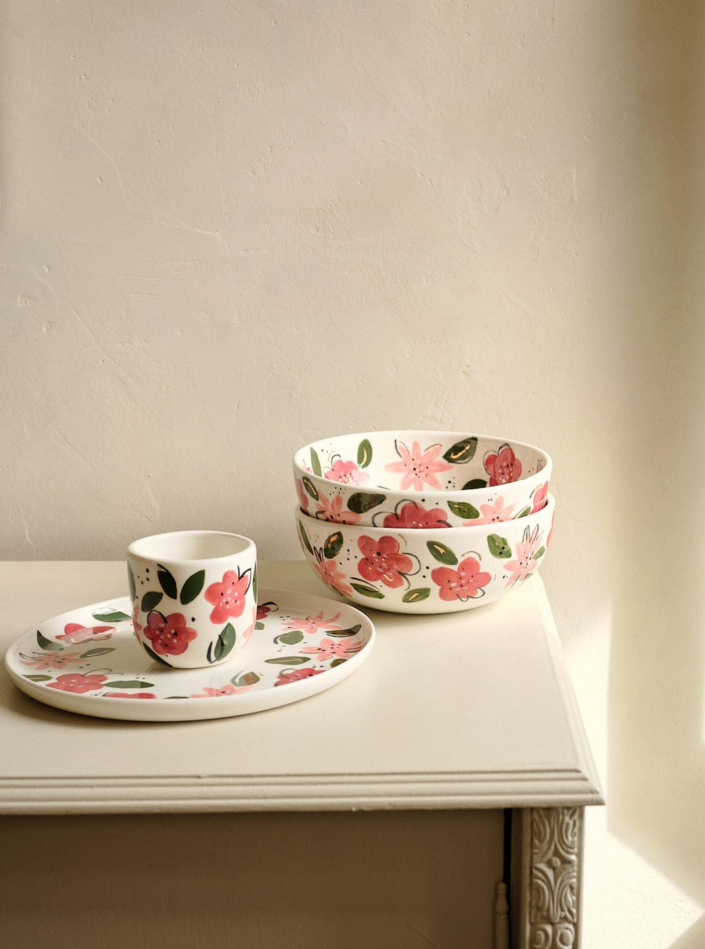 White porcelain salad bowl and matching cup with hand-painted pink and red floral pattern