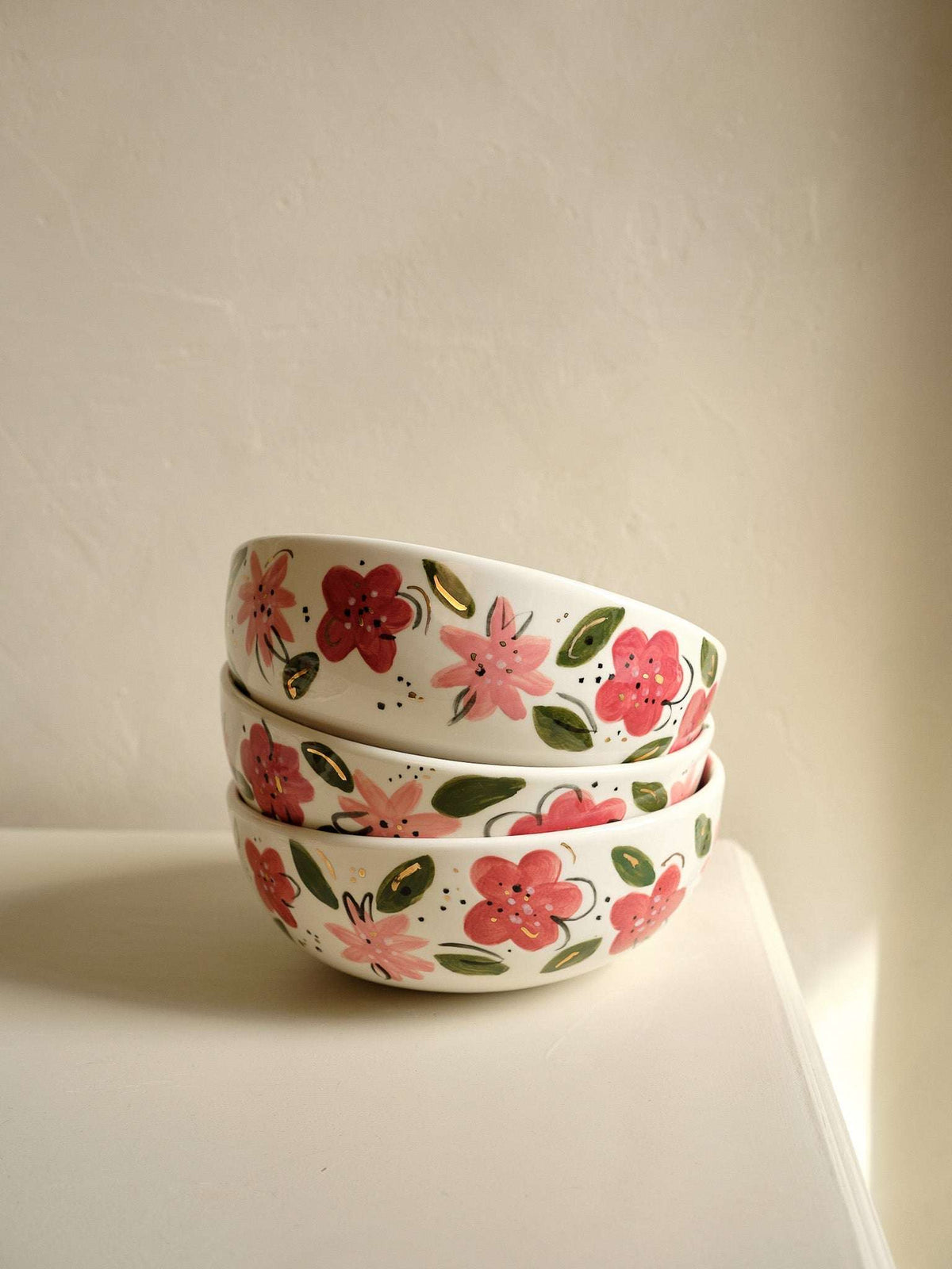 White porcelain salad bowl pair with hand-painted pink and red flower and leaf design
