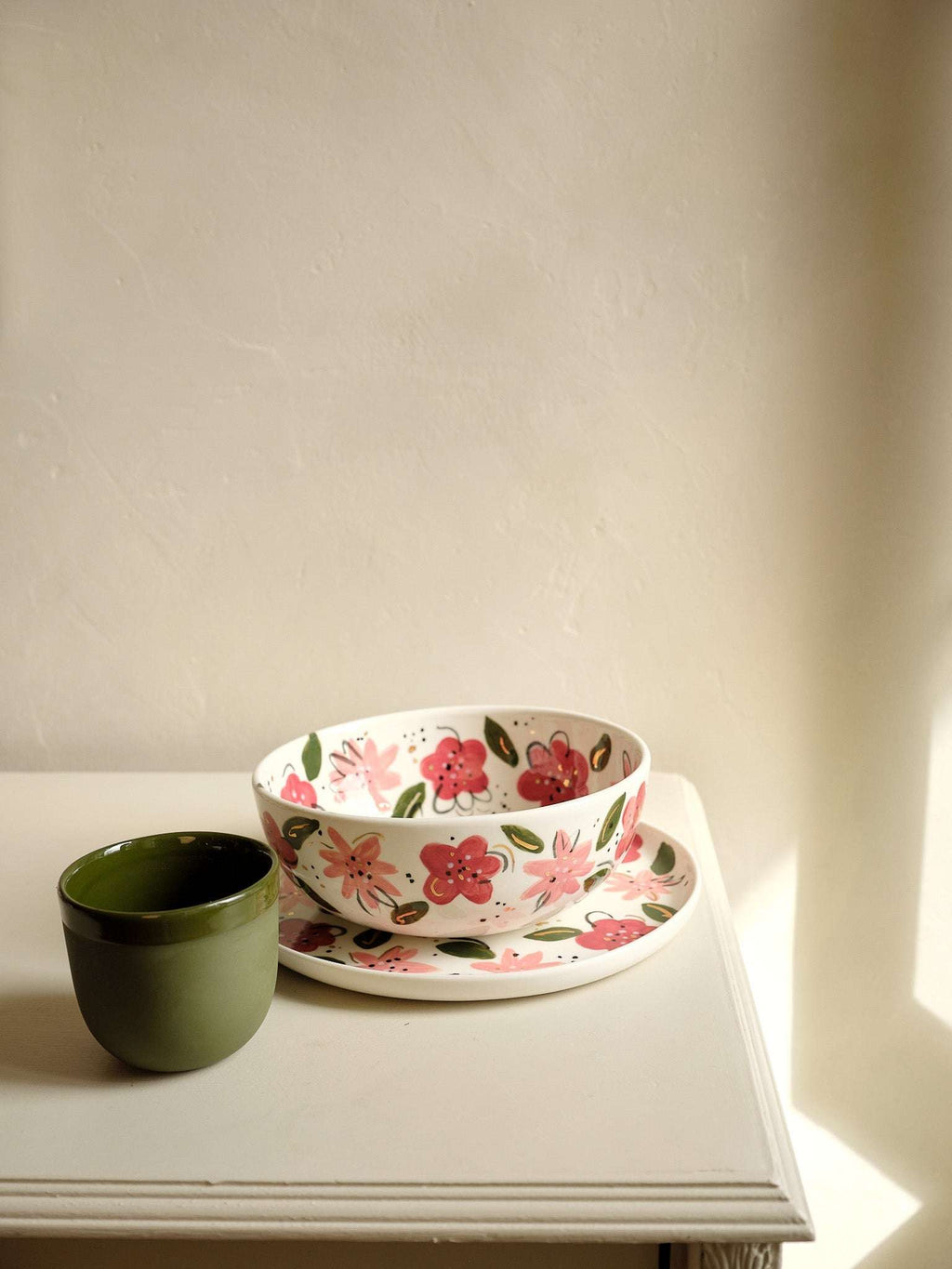 Hand-painted porcelain salad bowls with pink and red flowers and green leaves, nested