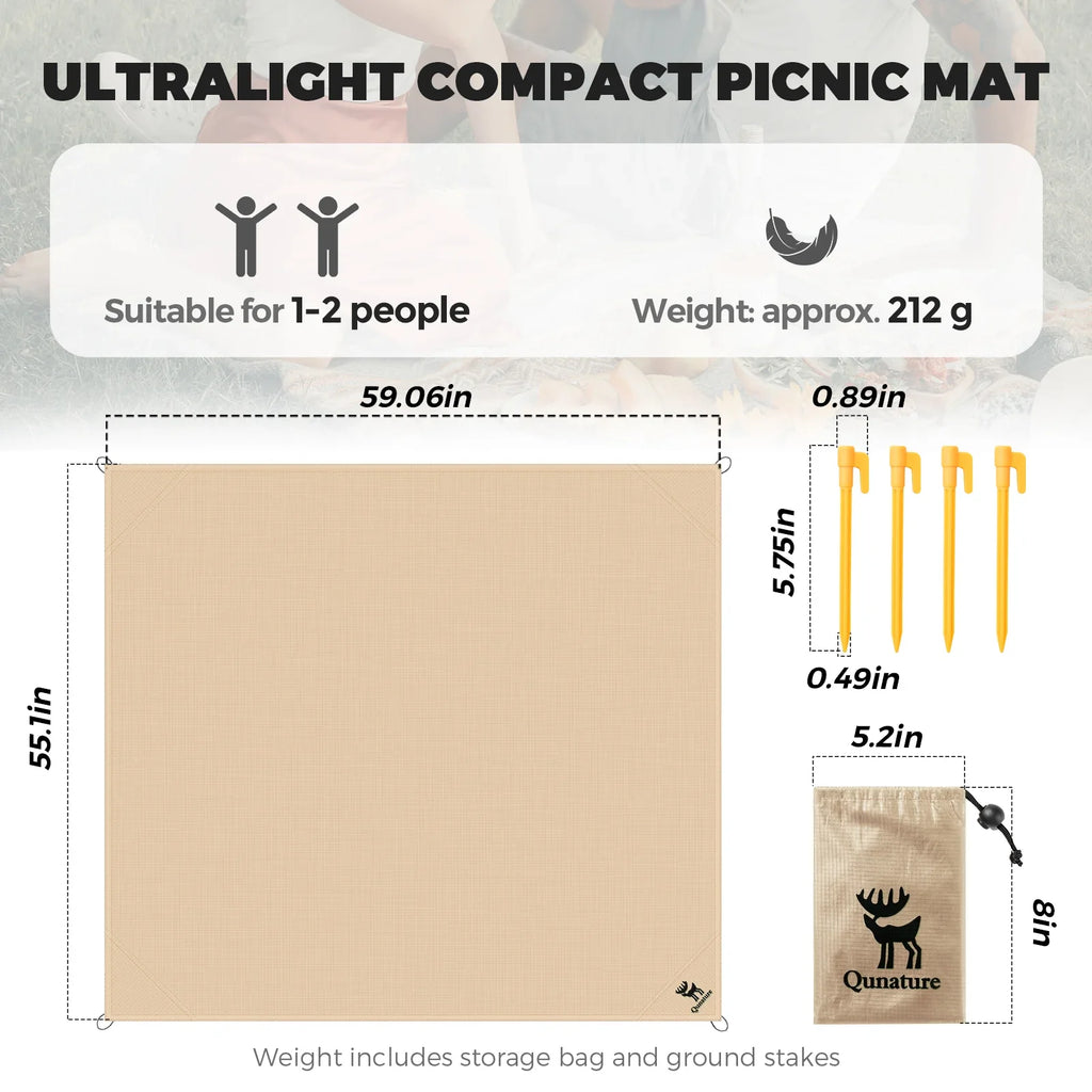 Khaki compact picnic mat laid flat with dimensions and included stakes