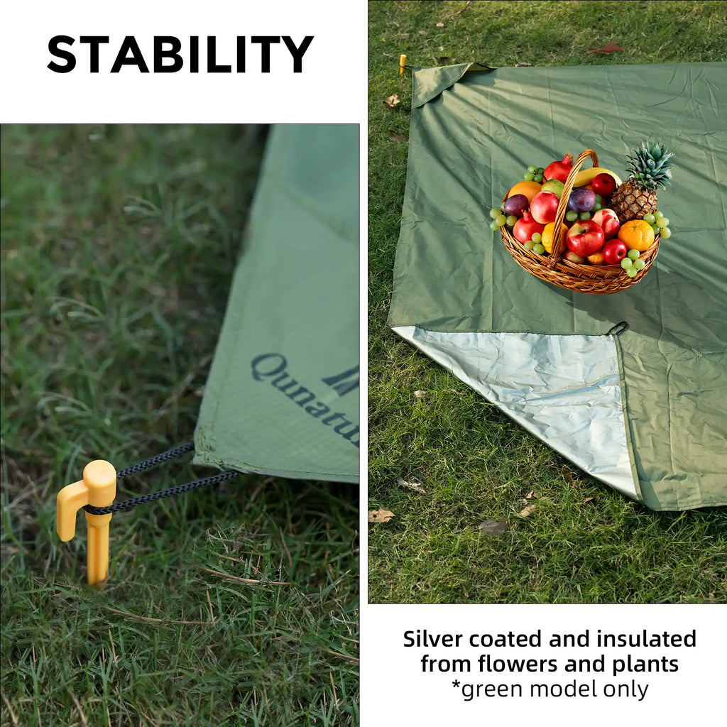Green picnic mat with silver-coated underside and ground stakes for stability