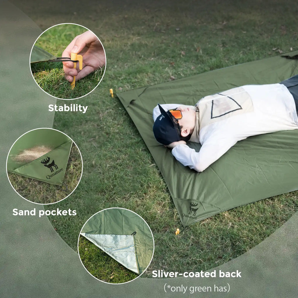 Green picnic mat with sand pockets and silver-coated backing for stability